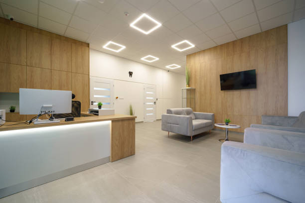 Modern clinic reception with warm wood panels and comfortable seating